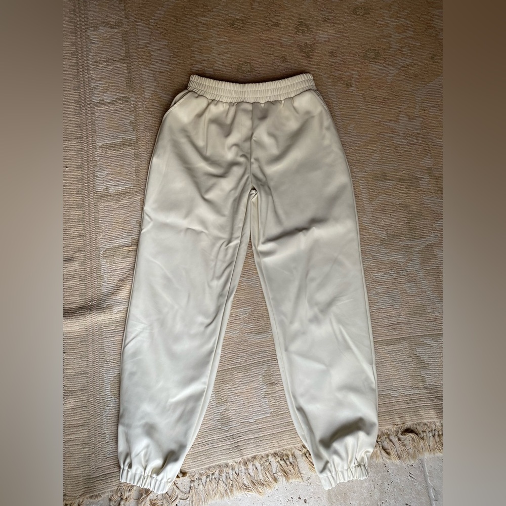 White faux leather joggers